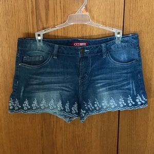 Ladies denim shorts with scalloped edge and decorated stitching. Size 30.